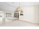 Open floor plan dining room looking toward Gathering room and pool at 8427 Boyce St, Spring Hill, FL 34606