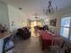 Open living and dining area with table and chairs at 8524 Corinthian Way, New Port Richey, FL 34654
