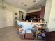Kitchen with breakfast bar and appliances at 8524 Corinthian Way, New Port Richey, FL 34654