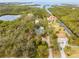 Aerial view showcasing waterfront homes and lush landscaping at 8711 Betty St, Port Richey, FL 34668