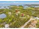 Aerial view showing home, vacant lot, and Gulf access at 8711 Betty St, Port Richey, FL 34668