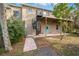 Spiral staircase leads to a deck and patio area at 8711 Betty St, Port Richey, FL 34668