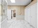 Spacious basement features marble floors, built-in storage, and an adjacent room at 8711 Betty St, Port Richey, FL 34668