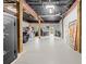 Spacious basement garage with high ceilings, ample storage, and epoxy flooring at 8711 Betty St, Port Richey, FL 34668