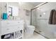 Clean bathroom with walk-in shower and white vanity at 8711 Betty St, Port Richey, FL 34668