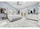 Main bedroom with king bed, lots of natural light, and access to private deck at 8711 Betty St, Port Richey, FL 34668