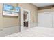 Bedroom with king-size bed and view of kitchenette at 8711 Betty St, Port Richey, FL 34668