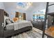 Spacious bedroom with large TV, dresser, and plenty of light at 8711 Betty St, Port Richey, FL 34668