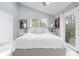 Main bedroom with king bed and access to a private balcony at 8711 Betty St, Port Richey, FL 34668