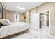 Bright bedroom with marble floors and access to other rooms at 8711 Betty St, Port Richey, FL 34668