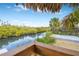 Peaceful view of the canal from a wooden deck at 8711 Betty St, Port Richey, FL 34668