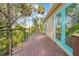Spacious deck with cable railings, offering scenic views and access from the house at 8711 Betty St, Port Richey, FL 34668