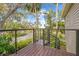 Wooden deck with spiral staircase and scenic view at 8711 Betty St, Port Richey, FL 34668