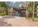 Two-story home with a double garage, inviting front porch, and landscaped yard at 8711 Betty St, Port Richey, FL 34668