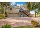 Two-story house with double garage, charming front porch, and brick driveway at 8711 Betty St, Port Richey, FL 34668