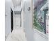 Elegant hallway with marble floors and access to multiple rooms at 8711 Betty St, Port Richey, FL 34668