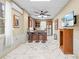 Modern kitchen with granite counters, wood cabinets, and breakfast bar at 8711 Betty St, Port Richey, FL 34668
