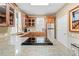 Modern kitchen with granite counters and stainless steel appliances at 8711 Betty St, Port Richey, FL 34668