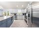 Modern kitchen with stainless steel appliances and granite countertops at 8711 Betty St, Port Richey, FL 34668