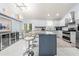 Modern kitchen with island and stainless steel appliances at 8711 Betty St, Port Richey, FL 34668