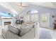 Spacious living room with sectional sofa, fireplace and vaulted ceiling at 8711 Betty St, Port Richey, FL 34668