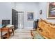 Home office with wood accent wall and safe, offering extra storage at 8711 Betty St, Port Richey, FL 34668