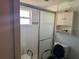 Bathroom with shower, toilet and grab bars at 9741 Star Trl, New Port Richey, FL 34654