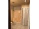 Small bathroom with shower and linen closet at 9741 Star Trl, New Port Richey, FL 34654