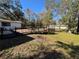 Wooden deck with railing, overlooking backyard at 9741 Star Trl, New Port Richey, FL 34654