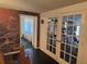 Dining room with French doors and nature wallpaper at 9741 Star Trl, New Port Richey, FL 34654