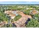 Aerial view showcasing a house, pool, and spacious lot at 10030 Orchard Way, Spring Hill, FL 34608
