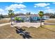 Aerial view of house, pool, and detached garage at 10030 Orchard Way, Spring Hill, FL 34608