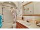Charming bathroom with shower/tub combo and decorative accents at 10030 Orchard Way, Spring Hill, FL 34608