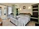 Guest bedroom with custom wood shelving and a full-size bed at 10030 Orchard Way, Spring Hill, FL 34608