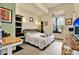 Cozy bedroom with built-in shelving and a full-size bed at 10030 Orchard Way, Spring Hill, FL 34608