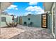Private courtyard with seating area and gated entrance at 10030 Orchard Way, Spring Hill, FL 34608