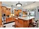 Gourmet kitchen boasts a large island, custom cabinetry, and high-end appliances at 10030 Orchard Way, Spring Hill, FL 34608