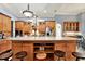 Gourmet kitchen boasting a center island, custom cabinetry, and high-end appliances at 10030 Orchard Way, Spring Hill, FL 34608