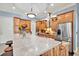 Spacious kitchen featuring an island, stainless steel appliances, and ample cabinetry at 10030 Orchard Way, Spring Hill, FL 34608
