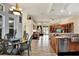 Open kitchen with island, breakfast nook, and view into living room at 10030 Orchard Way, Spring Hill, FL 34608