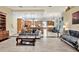 Open living room with a view into the kitchen and dining areas at 10030 Orchard Way, Spring Hill, FL 34608
