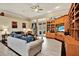 Comfortable living room with built-in shelving and access to a patio at 10030 Orchard Way, Spring Hill, FL 34608