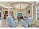 Relaxing living room with vaulted ceilings and comfortable seating at 10030 Orchard Way, Spring Hill, FL 34608