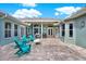 Charming brick patio with seating and outdoor kitchen at 10030 Orchard Way, Spring Hill, FL 34608