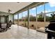 Relaxing screened patio overlooking a large backyard at 10030 Orchard Way, Spring Hill, FL 34608