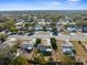 Wide angle aerial showcases the home in a community with mature trees, nearby commercial area at 10147 Spring Hill Dr, Spring Hill, FL 34608