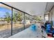 Screened back patio with concrete floor and grill at 10147 Spring Hill Dr, Spring Hill, FL 34608