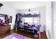 bedroom with bunk bed and colorful rug at 10147 Spring Hill Dr, Spring Hill, FL 34608