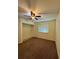 Spacious bedroom with ceiling fan, carpet flooring, and closet at 10176 Foley St, Brooksville, FL 34601