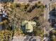 Aerial view of a home with large lot and mature trees at 106 Banana St, Tarpon Springs, FL 34689